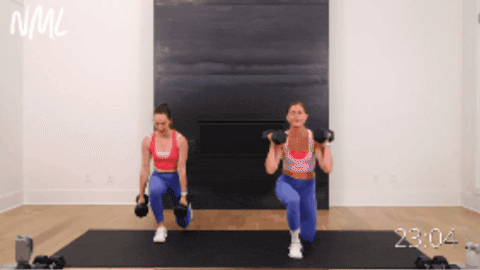 two women performing compound dumbbell exercise