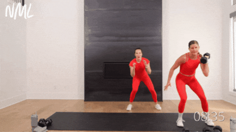 two women performing loaded lateral shuffles as part of at home hiit workout