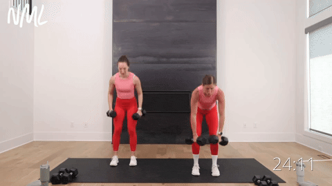 two women performing a dumbbell back row to bicep curl to overhead press in a full body workout