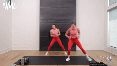 two women performing lateral shuffles in a full body workout