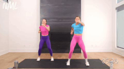 two women performing four jabs with two knee hits as example of beginner hiit exercise