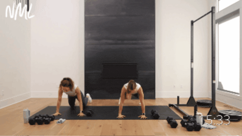 two women performing a push up, plank walk and single arm back row as example of best workout for abs and full body