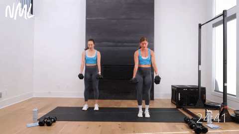 two women performing a wide squat to narrow squat with dumbbells in a full body workout