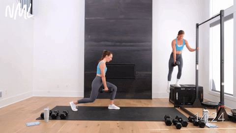 one woman performing step downs and one woman performing split lunges in a dumbbell workout