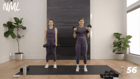 2 women performing a deadlift, clean and squat as part of hiit training home workout
