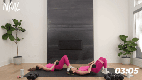 women laying on their backs performing glute bridges