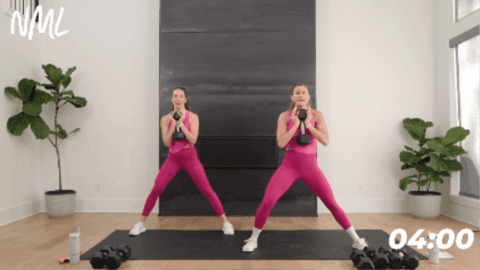 two women performing lateral squats as part of lower body strength workout