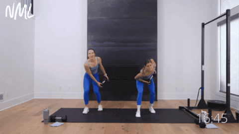 women performing a dumbbell chop as part of core workout routine