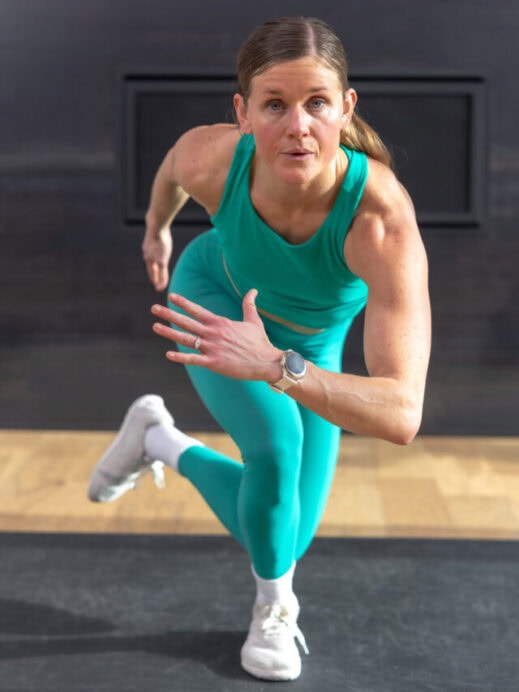 woman performing bodyweight skaters in a full body hiit workout