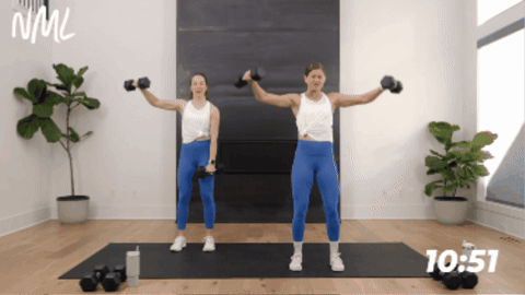 2 women performing lat raise and front raise combo as example of arm strength exercises