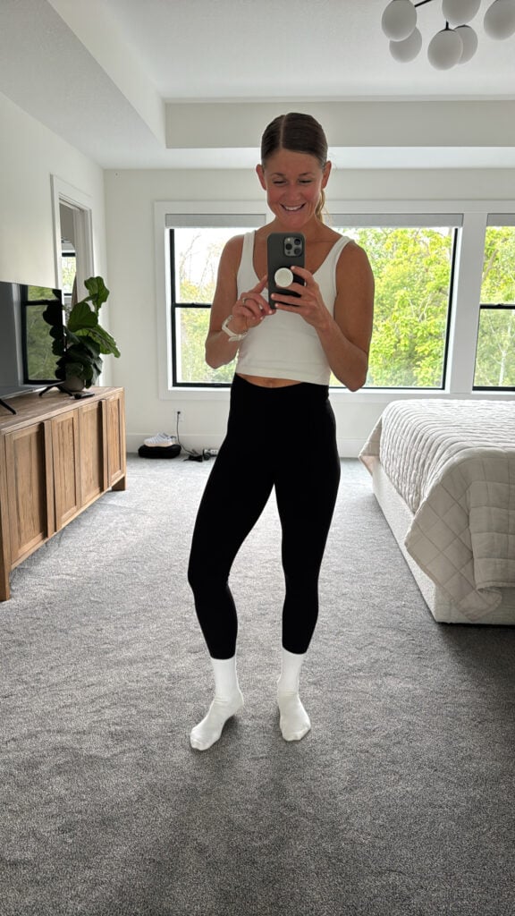 Woman wearing lululemon wunder train leggings as part of review of best lululemon leggings. 