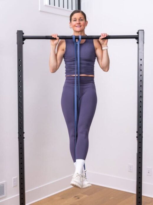 woman performing pull up as part of murph challenge