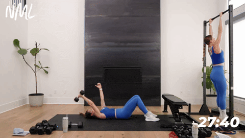 woman performing pull ups and woman performing a single arm lat pullover in a back and bicep workout
