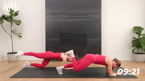 two women performing a single leg forearm plank and knee drop in a core workout for runners