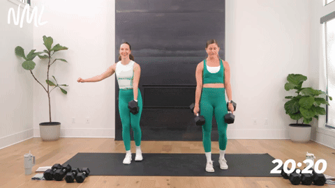 two women performing reverse lunges with dumbbells in a leg and glute workout