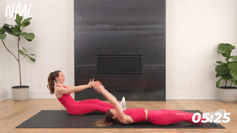 women performing a runner sit up in a core workout for runners