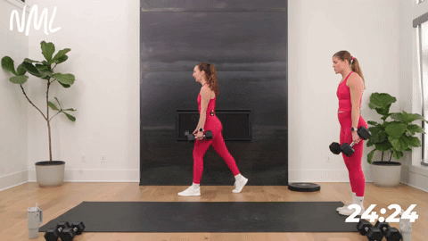 two women performing a lunge and knee drive in a strength workout for runners