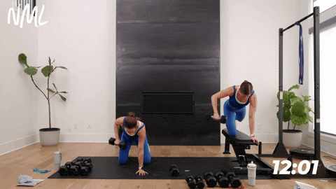 two women performing wide single arm back rows in a back and bicep workout