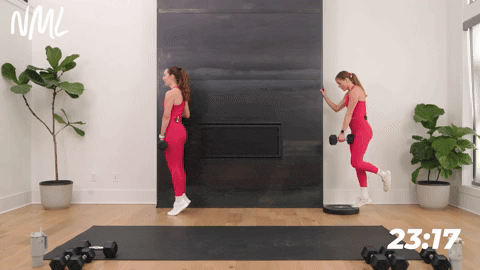 two women performing a calf raise in a strength workout for runners