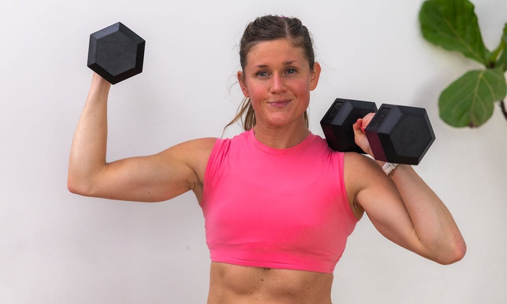 woman flexing after completing 5 minute arm workout