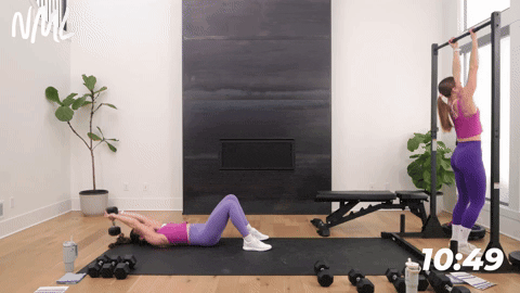one woman performing pull ups and one woman performing dumbbell pullovers in a back and bicep workout