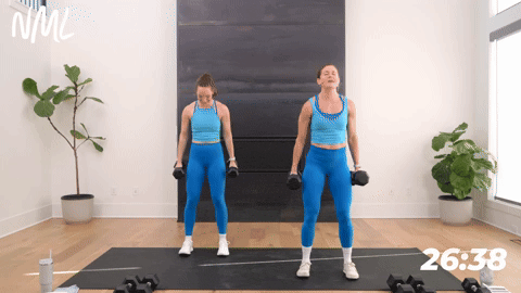two women performing one bicep curl into two shoulder presses
