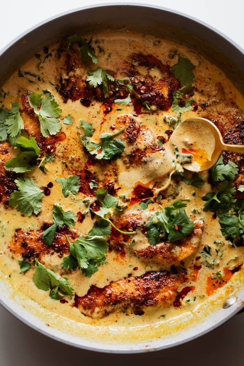 Chicken with coconut kale made with kale, yellow curry, coconut milk and soy sauce. 