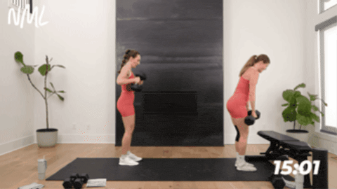 One women performing a deadlift clean knee drive. One women performing a deadlift clean knee drive onto a bench.