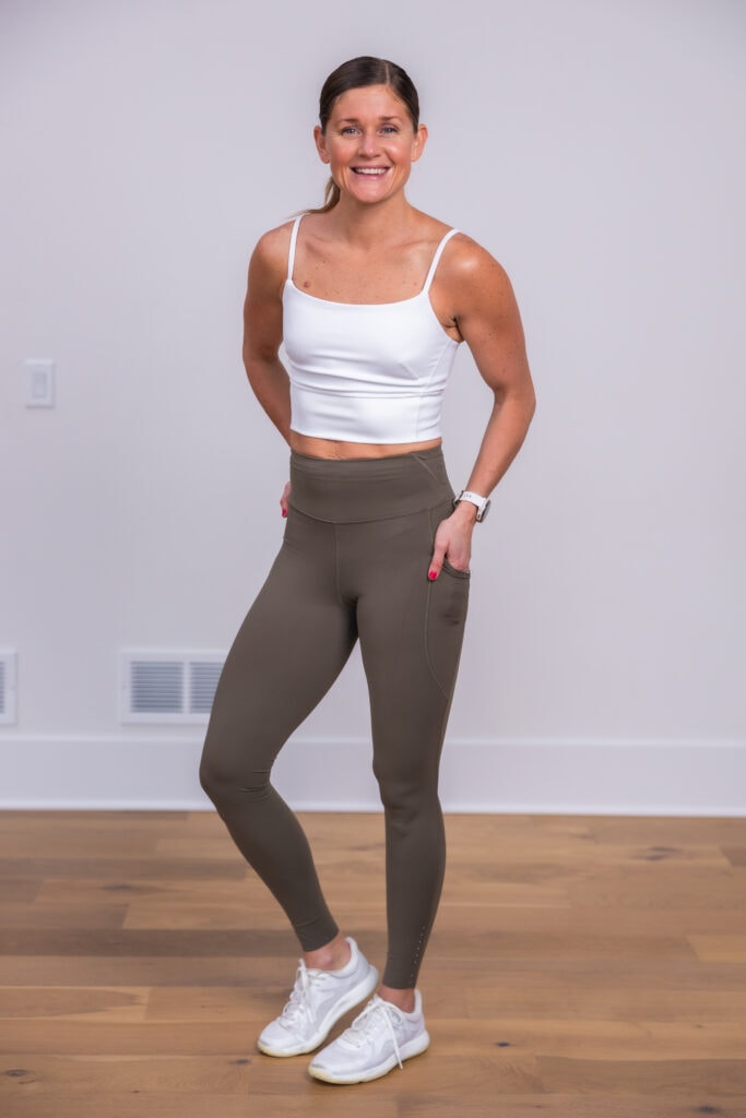 Women posing in tan fast and free leggings with wunder train tank top.