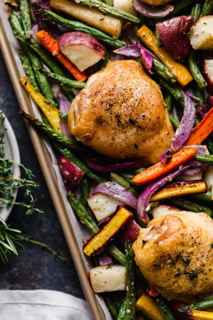 Sheet pan chicken with roasted vegetables made with chicken thighs | High protein chicken recipes