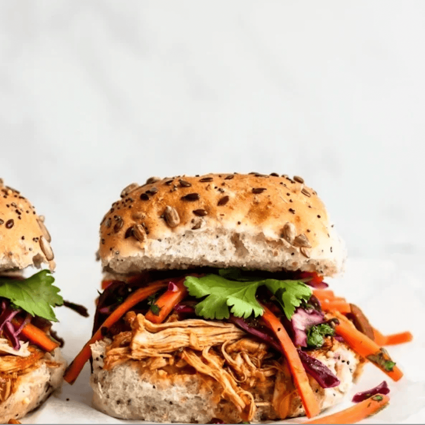 Slow cooker or crockpot pulled chicken sandwiches made with chicken thighs