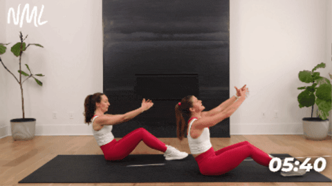 women performing arm sweeps to activate total abs