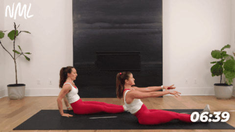 women showing how to do pilates c-curve spine and knee drive