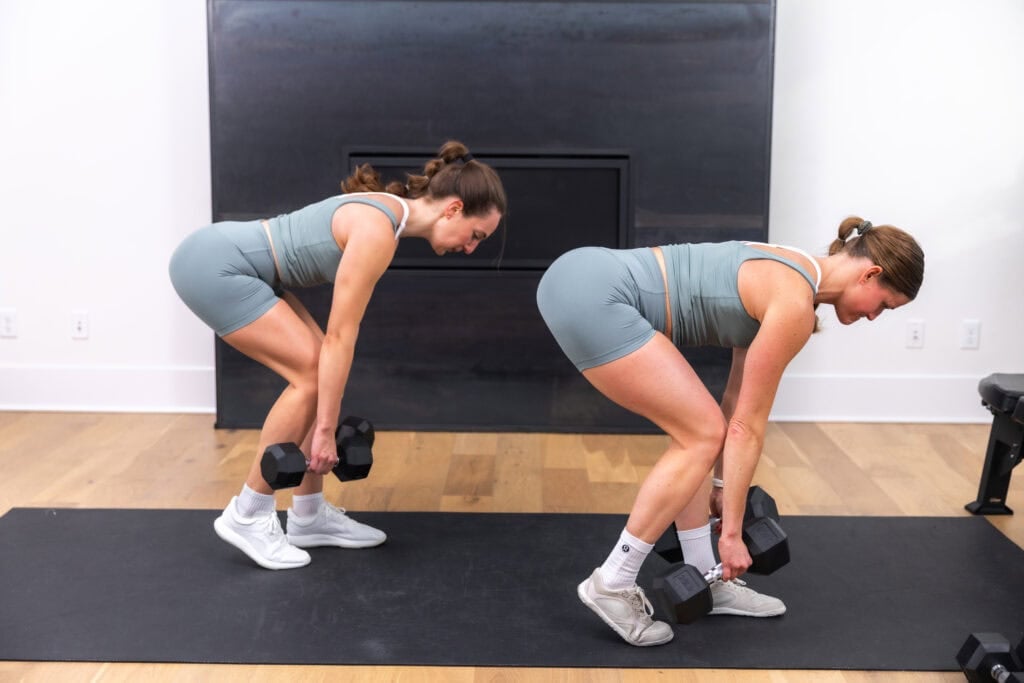 women performing a staggered deadlift with dumbbells as part of glute and hamstring workout