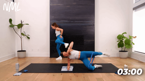 One women performing Clamshell Lift and kick out and one women performing standing kicks.