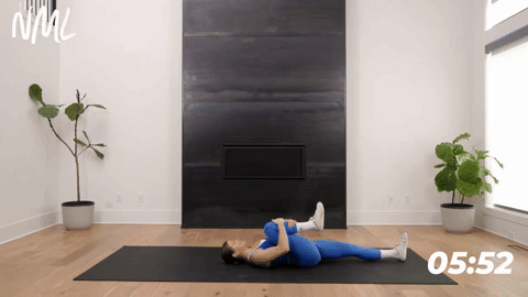 Women performing a Lying Knee to Chest Rotation as part of stretching exercises for hip pain.