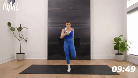 Women performing a standing hip flexor stretch or quad stretch. 