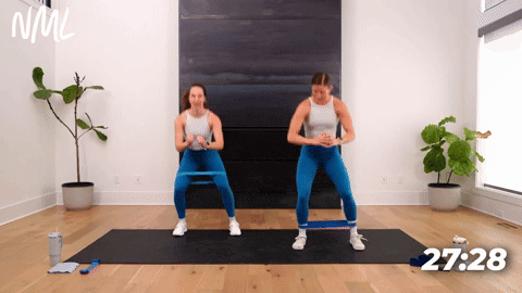 Women performing side to side squats