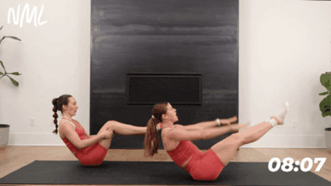 women performing pilates hundreds exercise