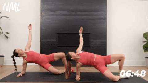 women in pilates class performing modified side plank