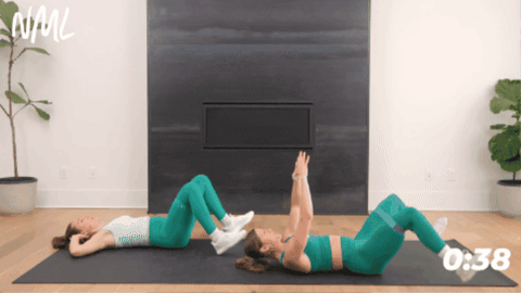 women performing v-taps to target lower abs