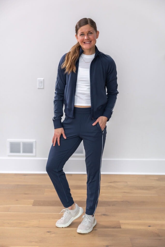 Everlux slim high rise track pant and jacket in true navy with a cotton baby tee in white.