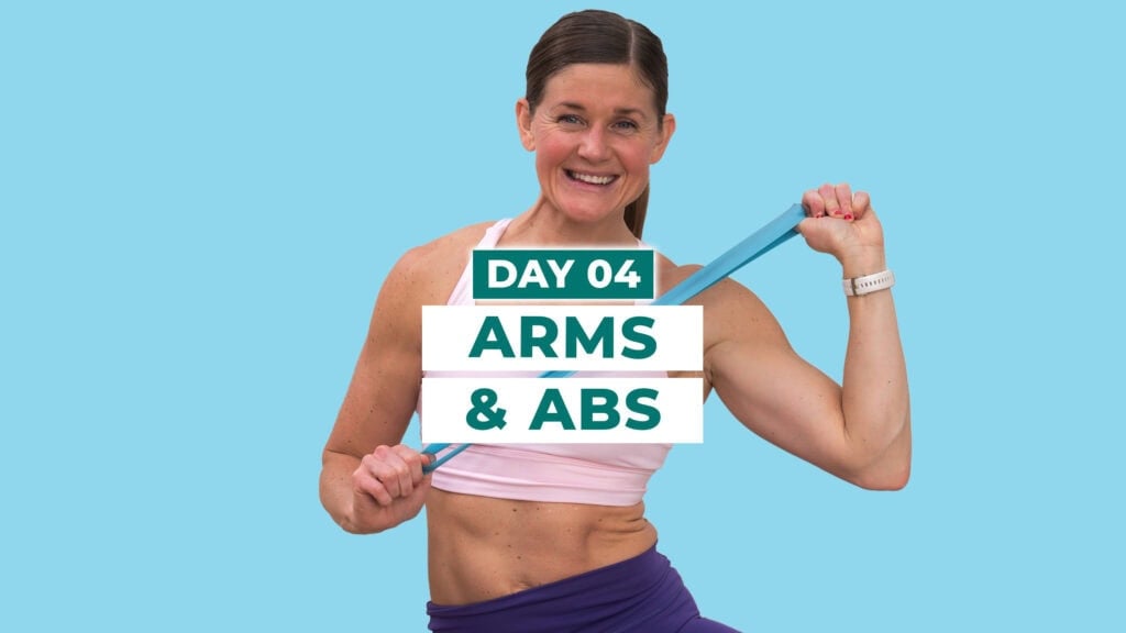 woman flexing abs with a resistance band as part of an abs and arm workout