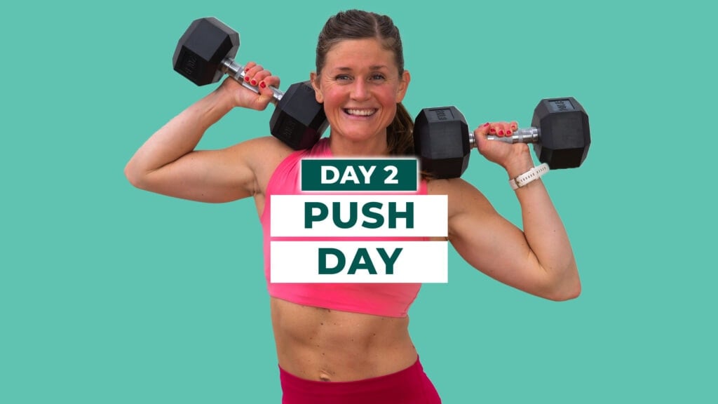 Woman holding dumbbells at shoulders as part of upper body push workout