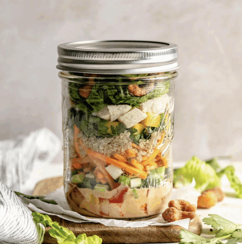 Thia Inspired Chicken salad stored in a mason jar.