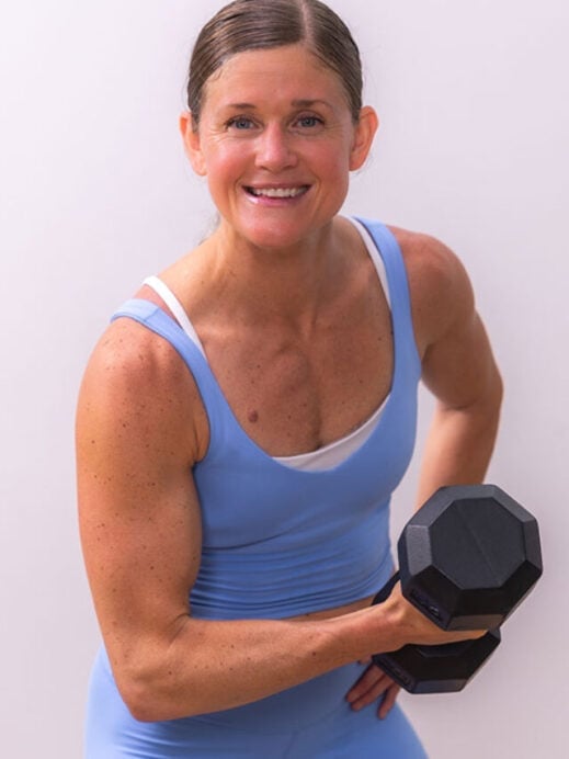 woman flexing to show toned arms