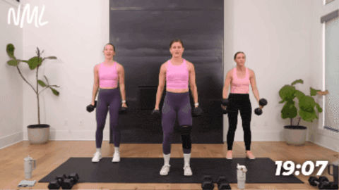 3 women performing a bicep curl and shoulder press as part of full body circuit workout