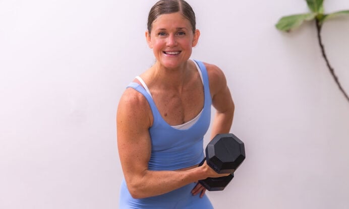 woman flexing to show toned arms