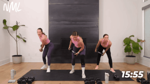 women performing a dumbbell chop as part of at home full body workout