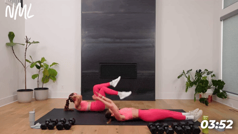 woman performing sprinter sit ups and woman performing modified bicycle crunches in a full body workout